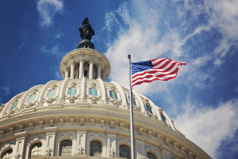 Capitol dome, United States of America flag flying