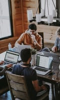 people working at computer desks